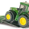 Freightliner Tieflader mit John Deere Traktoren